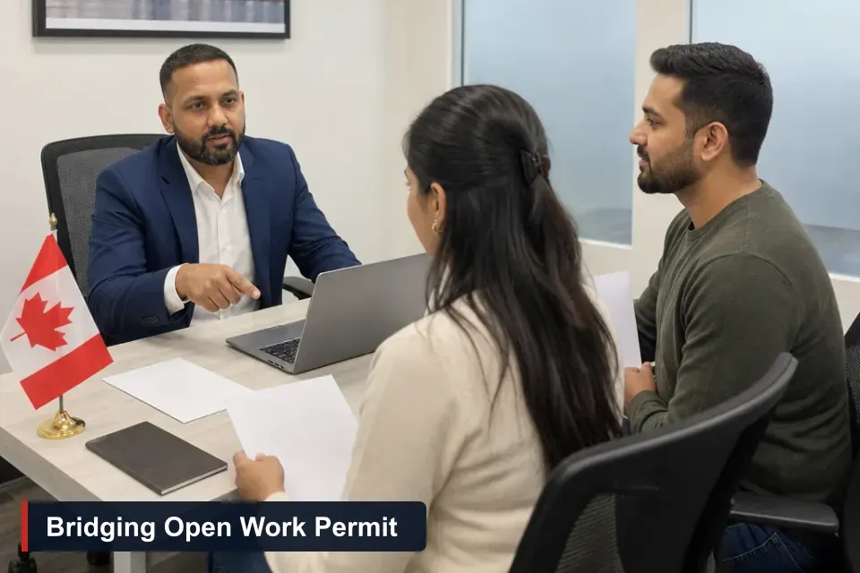 Bridging open work permit eligibility: Sanjay Singh Kumar, RCIC at VMC Immigration, reviews a client's PR AOR and work permit at his Brampton office.